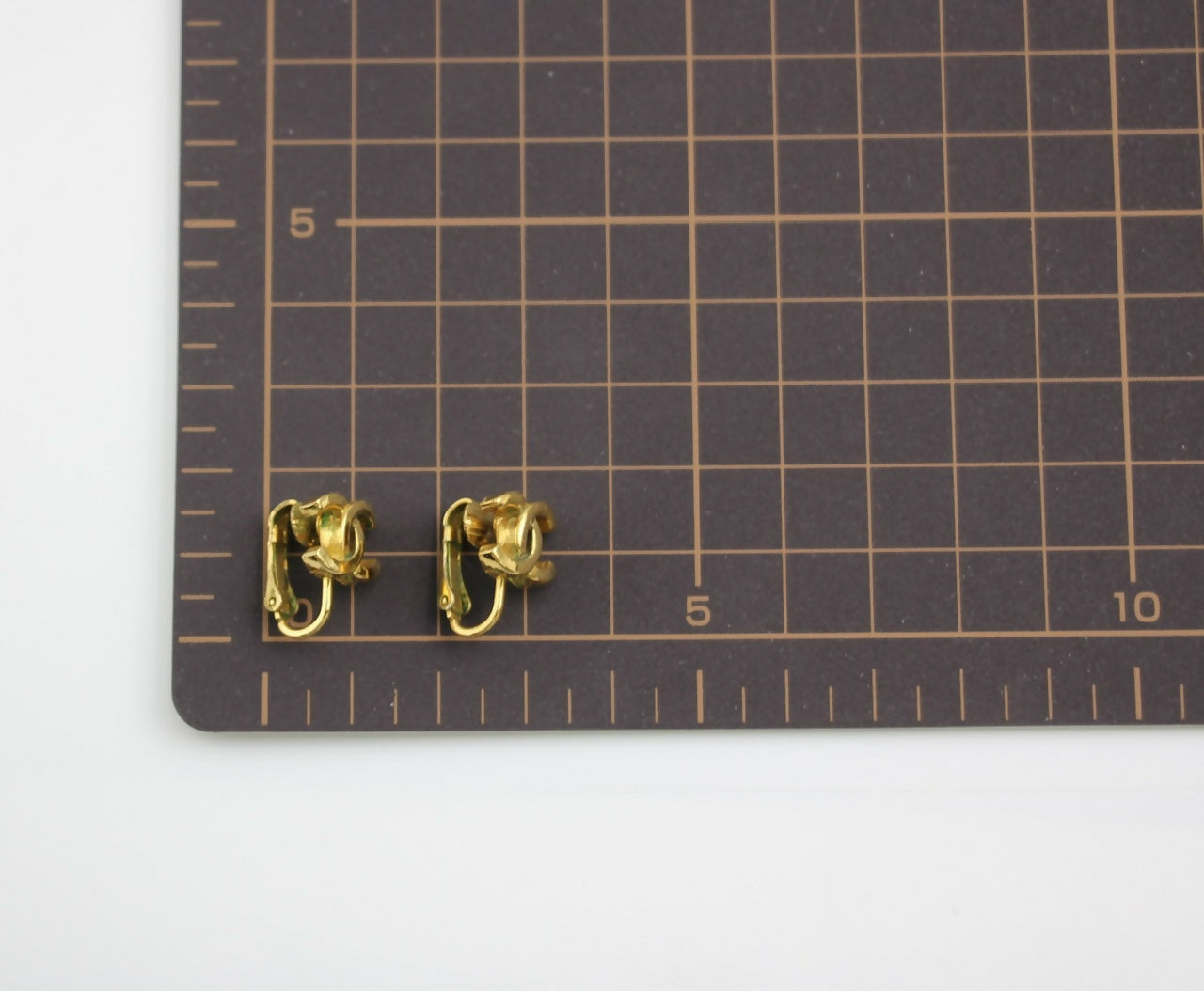 Chanel Vintage 1971-80 Gold-plated Curved Buckle CC Clip-on Earrings
