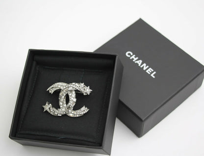 Chanel C21S Rhinestone Metal Silver Star Twist Brooch