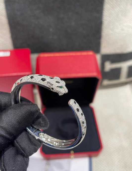 PANTHÈRE DE CARTIER BRACELET White gold, emeralds, onyx, diamonds size 16
