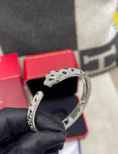 PANTHÈRE DE CARTIER BRACELET White gold, emeralds, onyx, diamonds size 16