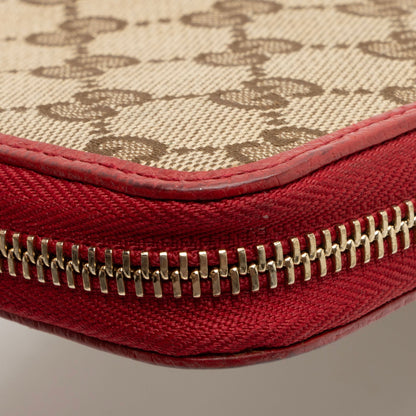 Gucci GG Canvas Zip Around Wallet (SHF-pjF8AV)