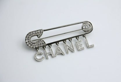 Chanel B18P Rhinestone Metal Thick ‘CHANEL’ Brooch