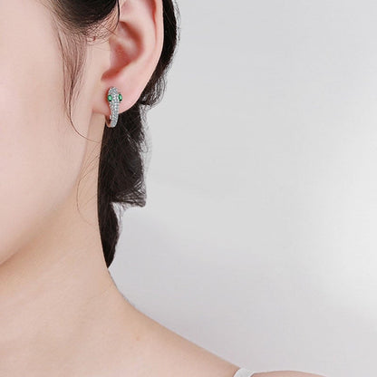 Silver Green Eye Snake Earrings