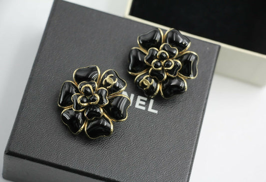 Chanel Vintage 02A Gripoix Shiny Black Large Camellia Clip-on Earrings